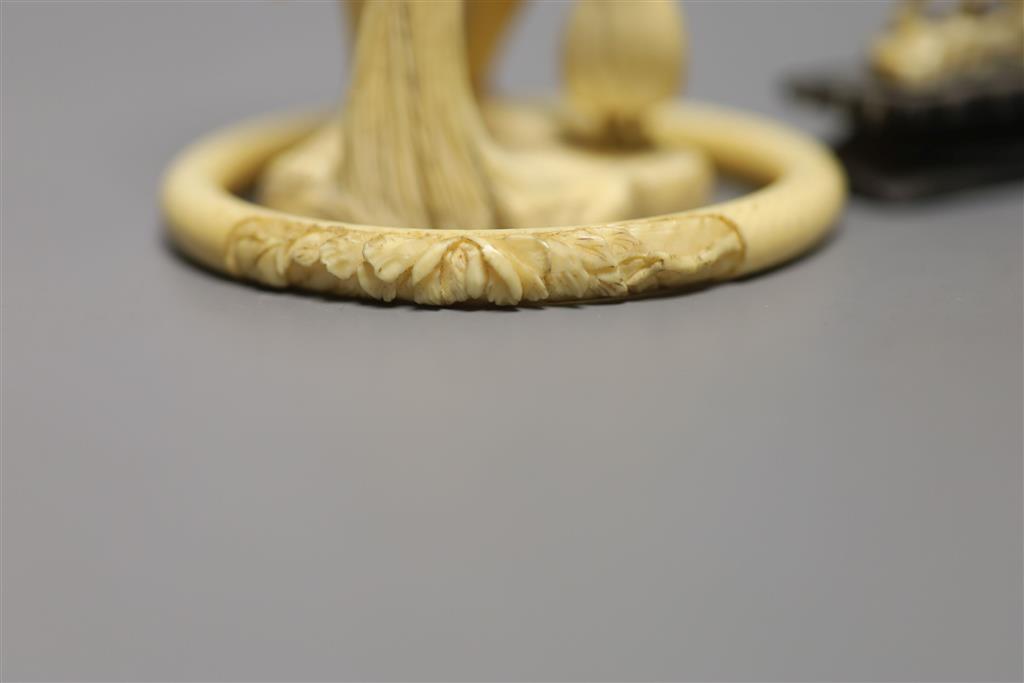 A Japanese carved ivory figure, male with brush, Meiji period, an elephant, a fisherman and a bangle